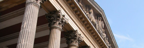Pedimental sculpture and columns on the front of the historic Victoria Rooms. 