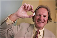 Professor Terence Cosgrove holding a piece of Clean Gum