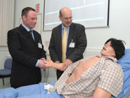 Dr Eugene Lloyd, Teaching Fellow, giving a demonstration to Professor David Eastwood on STAN - the Human Patient Simulator.
