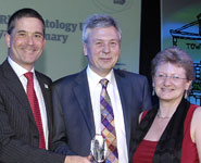 From left: Simon Gillespie, Chief Executive of the MS Society (sponsor of the Long-Term Conditions category), presents the award to Professor John Kirwan (University of Bristol) and Professor Sarah Hewlett (UWE)