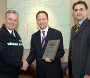 From left to right: Superintendent Geoff Spicer of Avon and Somerset Police presenting the award to Jerry Woods, Security Services Manager and Parviz Partow, Director of Estates Services, Bristol University.