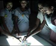 Children from a school in Delhi working with the interactive table