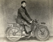 Young man on a 'motorbike' in a photographer's studio, probably in Shanghai, c.1950. Print purchased in a junk shop, Jing'an district, Shanghai, 2010. Photographer unknown.