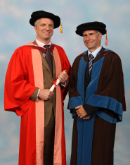 Ben Morris receives his honorary degree from Professor Stuart Burgess