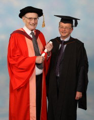 John Sansom receives his honorary degree from Michael Liversidge