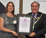 Amy Watts receives her award from Councillor Colin Hall, Chairman of North Somerset Council