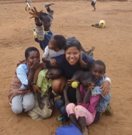 Juliette Denny with local children in Kenya