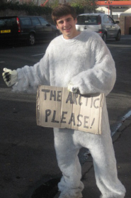 Marcus Scaramanga in his polar bear suit trying to hitchhike to the Arctic