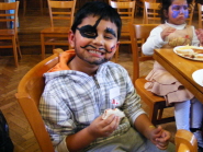 A youngster shows off his face painting at the Christmas Party
