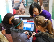 Youngsters get to grips with an exhibit