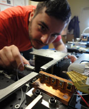 PhD student Erman Engin measuring the performance of a silicon quantum chip.