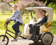 Sam Harris offers newlyweds a Pedal Power Transport rickshaw ride