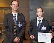 Chris Howcroft receiving his award from Michael Schoenwetter, Head of Research and Technology Partnerships at Airbus
