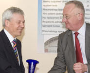 John Kirwan, Professor of Rheumatology, receives a trophy from the Vice-Chancellor