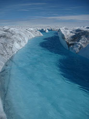 Meltwater channels on the surface of the Greenland Ice Sheet; tracer results showed that similar types of channelized drainage are present at the ice sheet bed and beneath large ice thicknesses