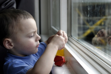 Generic image of a baby looking out the window