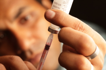 Generic image of someone using a syringe