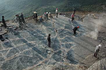 Image of the Luoping footprint site under excavation. Students and farmers help to clear the Shangshikan footprint site in summer, 2009, prior to photography and mapping