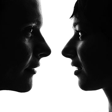 Image of a man's and woman's faces in profile