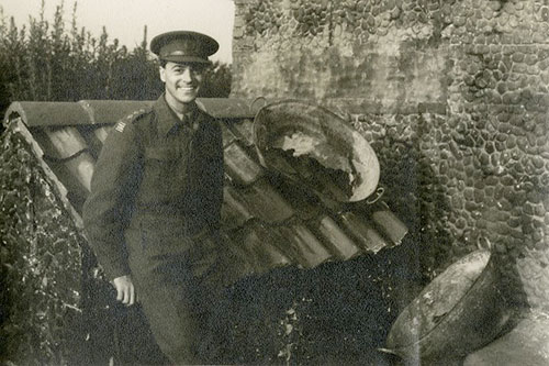 Image of Oliver Messel during the Second World War with fake farmhouse created to disguise military installation © University of Bristol Theatre Collection
