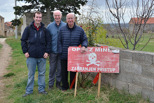 Image of Dr Oliver Payton and Dr John Day with Sir Bobby Charlton on a visit to mined areas in Croatia