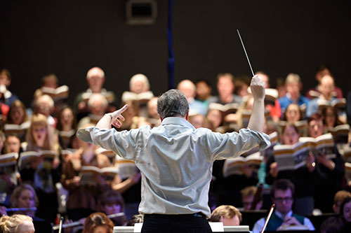 Image of Professor John Pickard conducting the Bristol University Symphony Orchestra
