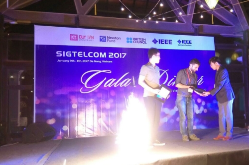 Image of Andrea Tassi receiving his prize for best paper at the Signal Processing, Telecommunications & Computing (SigTelCom) 2017 conference.