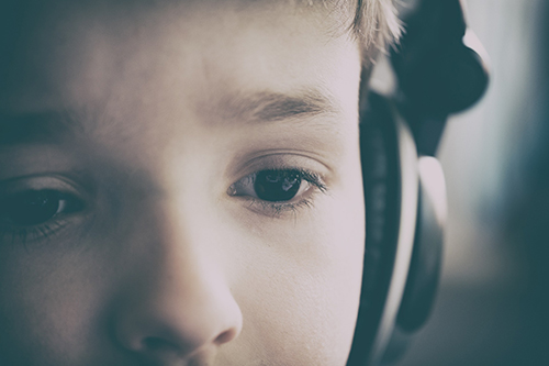 Generic image of a young boy with headphones