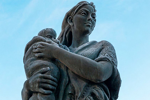 National Child Mortality Database (NCMD) Programme Thematic Report’s cover image that shows a stone sculpture of a woman holding a child