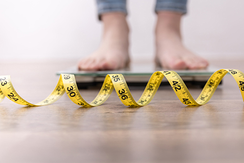 A person standing on weighing scales