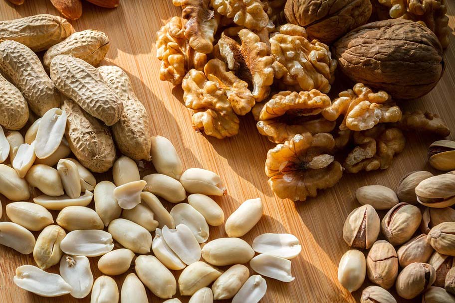 Mixed nuts on a wooden platter
