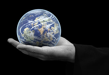 Image of the earth held in the palm of a hand