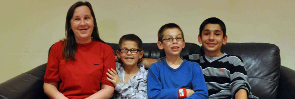Jennie, single parent with 3 teenage boys sitting on sofa