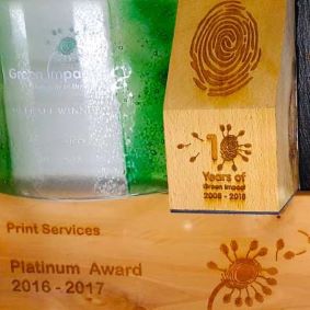 Trophies received from the Green Impact Award Scheme through participation across a number of years, some made from Glass and some from Wood