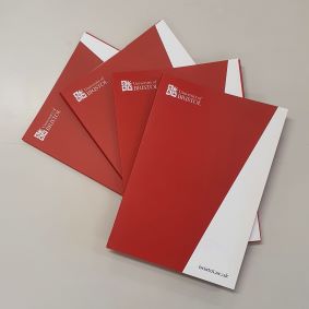 An image showing a fan of UoB Capacity Folders with Red to the left and white to the right separated by the UoB 13 degree angled edge, the folders have the logo printed in white top left and the web address "bristol.ac.uk" in black on the bottom right