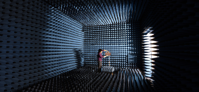 Researcher setting up anechoic chamber in Department of Engineering 