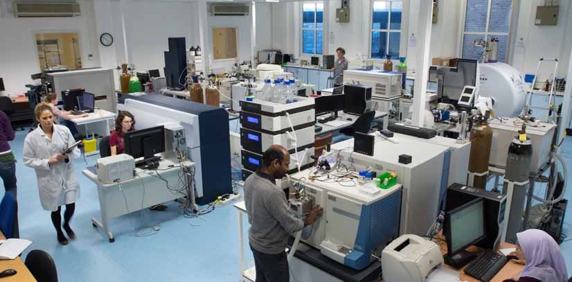 Mass spectrometry lab with academic staff and researchers working