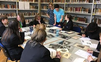 Year 9 students from Oasis Academy comparing archives for the classic French comedy 'Tartuffe' at the University's Theatre Collection