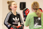 Image of two young women boxing