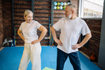 Image of two older adults doing exercise