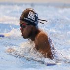 A man swimming, wearing a University of Bristol Swim cap. Links to Lifesaving club page on Bristol SU Website