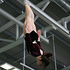 Person upside down on a trampoline. Image links to Trampoline club page on Bristol SU website.	