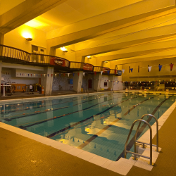 The University of Bristol Swimming pool before the LED light upgrade took place resulting in the swimming pool and picture having a slight orange light.