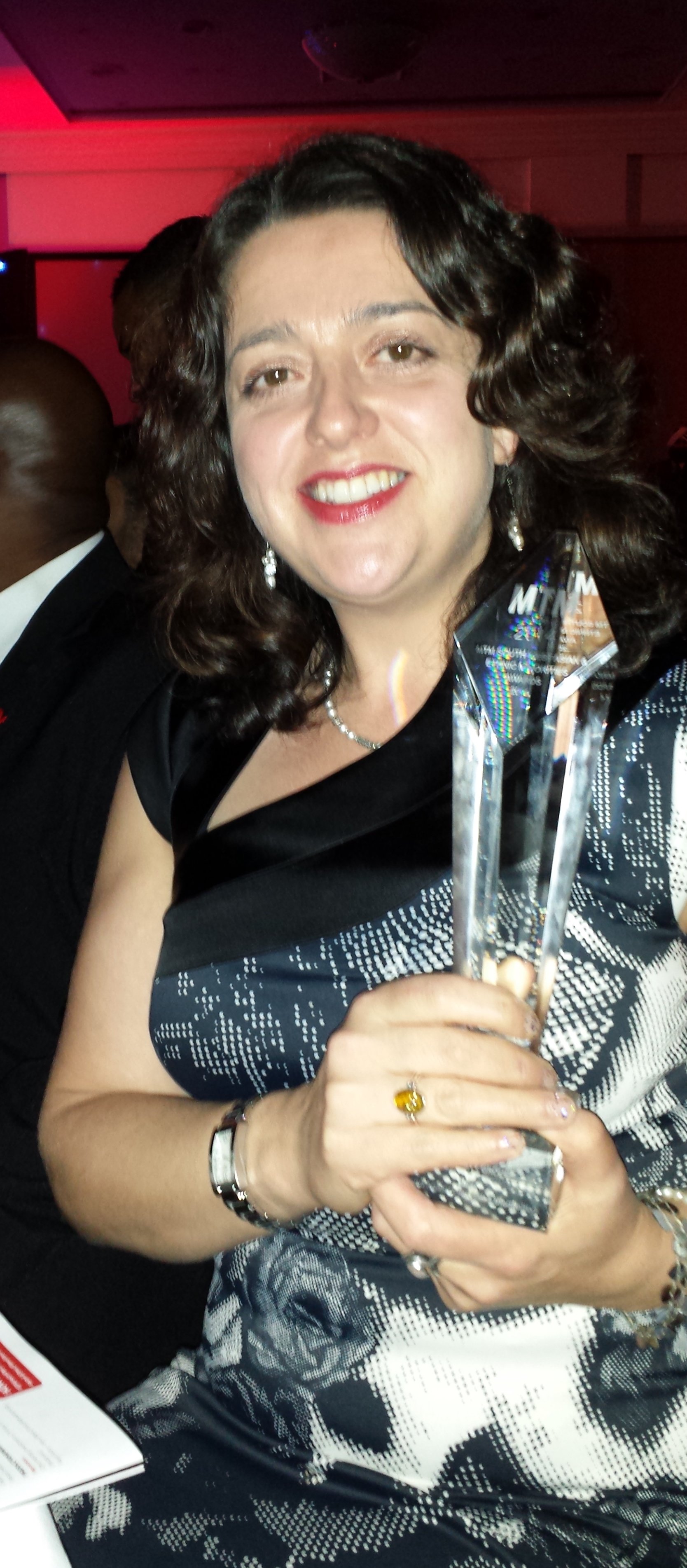 Alex Ardalan-Raikes with her MTM Award in 2014