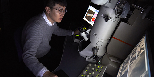 A student working on a piece of equipment.