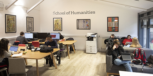 Students studying in the School of Humanities common room.