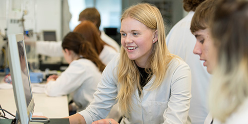 Students working at computers in a laboratory.