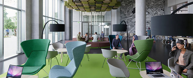A colourful room with mixed seating areas and people working on laptops.