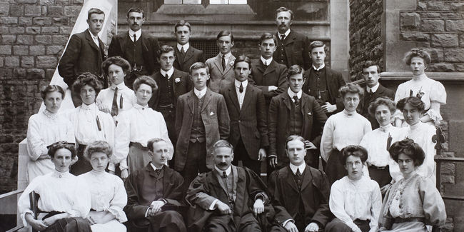 An old staff photograph featuring men and women